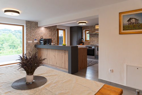 Cozy dining room interior at Zidanica v Gaj with rustic wooden furniture